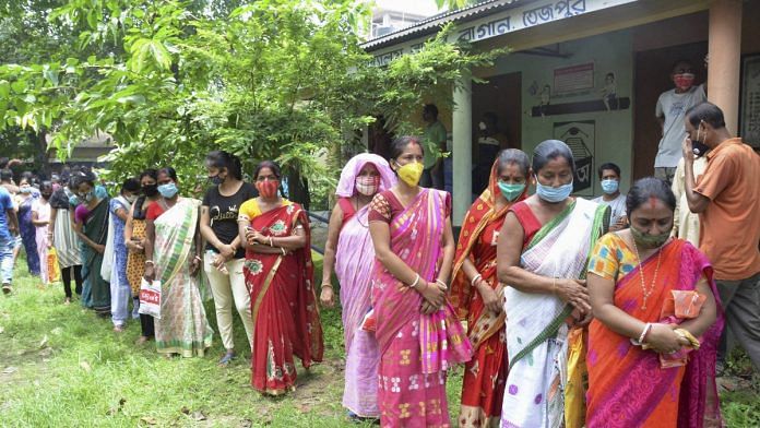 Beneficiaries wait in a queue to receive Covid-19 vaccine outside a centre in Sonitpur district on 11 July 2021 | Photo: PTI