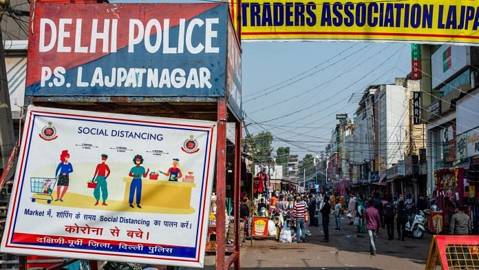 Signs for social distancing, sanatising and wearing masks at the Lajpat Nagar market in New Delhi | Photo: Prashanth Vishwanthan | Bloomberg File Photo