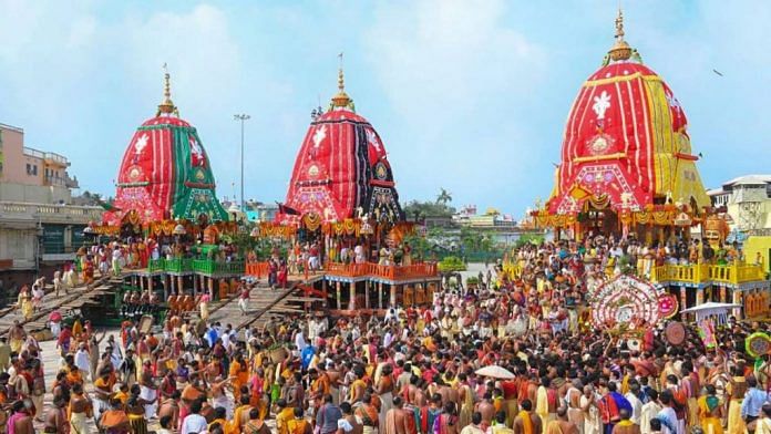 Priests and devotees take part in the 'pahandi' rituals of Lord Jagannath Rath Yatra in Puri on 23 June 2020 | PTI