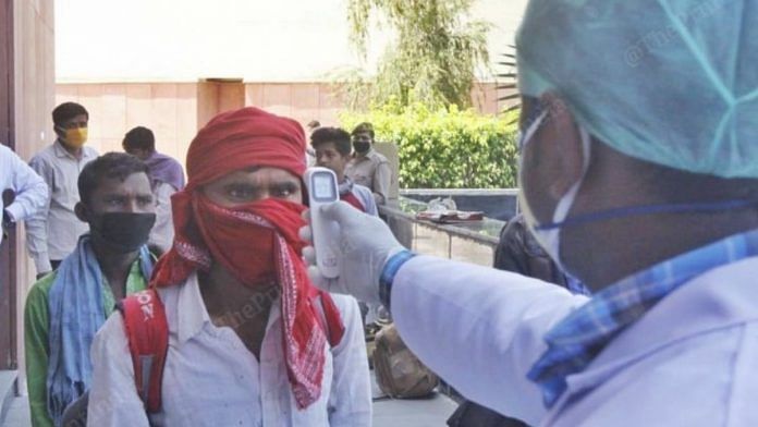 A doctor checks the temperature of a person as part of the Covid-19 screening process. | Representational Image | Praveen Jain | ThePrint