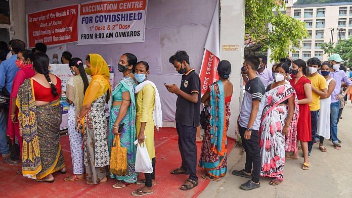 Beneficiaries wait in a queue to receive Covid-19 vaccine dose, at GMCH in Guwahati on 1 July 2021 | Photo: PTI