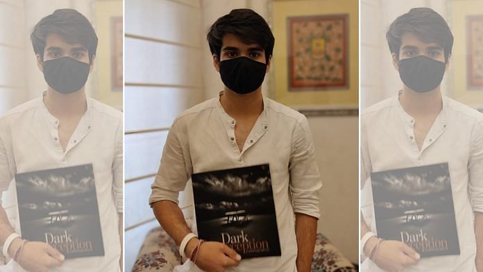 Raihan Vadra, 20, the son of Congress leader Priyanka Gandhi Vadra and businessman Robert Vadra, holds a catalogue for his exhibit 'Dark Perceptions' | Shubhangi Misra | ThePrint