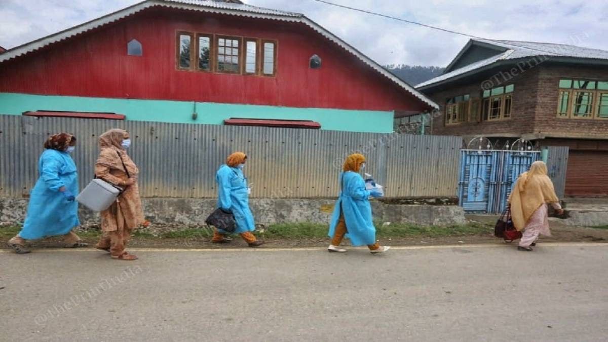 Health workers accompanying a doctor during a vaccination campaign at Mantrigam village, Bandipora district, Kashmir valley | Praveen Jain | The Print