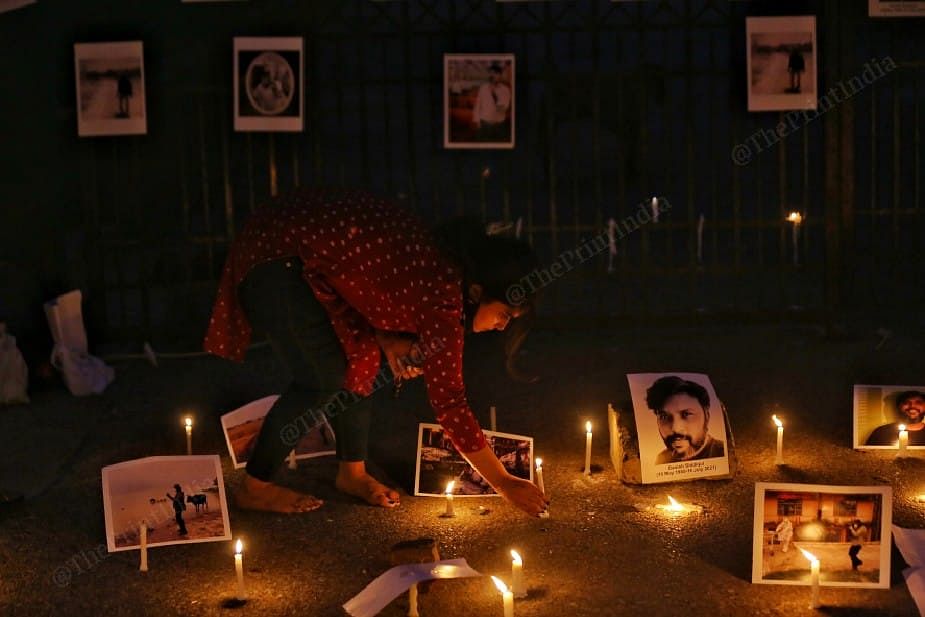 A girl lit candle outside jamia gate | Suraj Singh Bisht | ThePrint