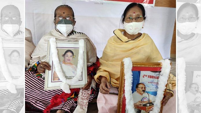 Ima Moirangthem Sorojini and Ima Gyaneshwori, who participated in the 2004 protest, hold pictures of two fellow protesters who have passed away since | Simrin Sirur | ThePrint