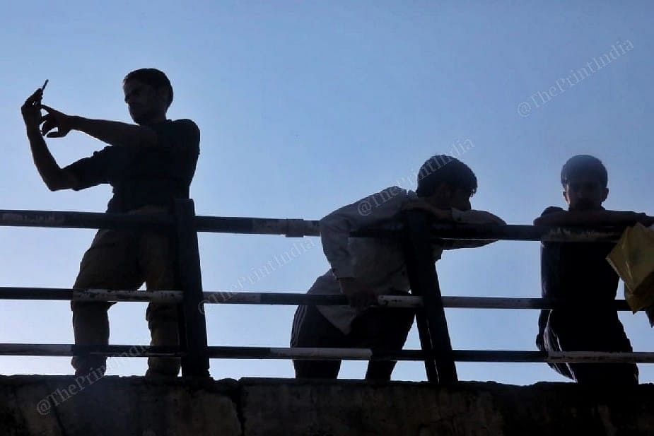 Local villagers watching match on the top of the bridge at Nihama cricket stadium. Kulgam | Photo: Praveen Jain | ThePrint