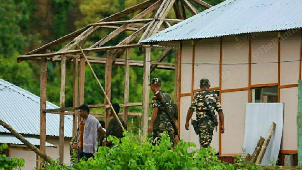 Mizoram Police personnel at the under-construction post (left) that allegedly sparked the clashes | Photo: Praveen Jain/ThePrint