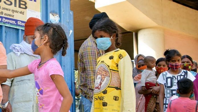 Children in masks at a centre distributing masks and hand sanitizer in New Delhi | Representational image | ANI Photo