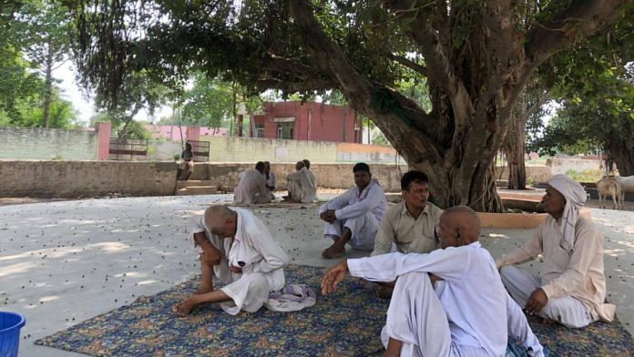 The Karhans card players under the banyan tree opposite the medical dispensary | Jyoti Yadav | ThePrint