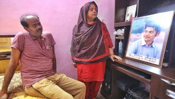 parents Sachin Chauhan's parents, Suresh and Anita, with his photo | Praveen Jain | ThePrint
