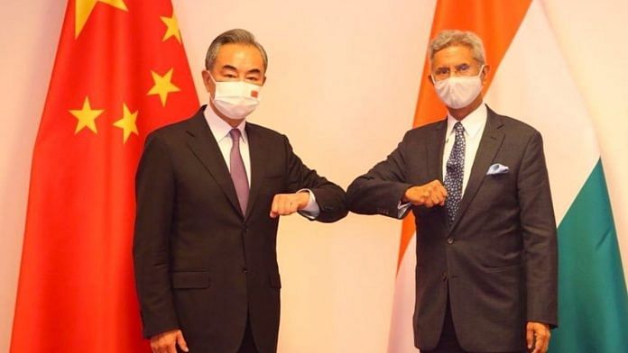 External Affairs Minister S. Jaishankar and Chinese State Councillor Wang Yi at their Dushanbe meeting on 14 July 2021. | Photo: Twitter/@DrSJaishankar