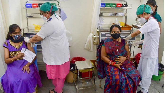 Covid Health workers inoculate beneficiaries against Covid-19, at a vaccination centre in Mumbai on 23 August 2021| PTI