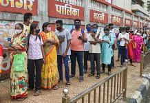 Beneficiaries wait in a queue to receive Covid vaccine dose, at a vaccination centre in Mumbai, on 12 August 2021 | Kunal Patil | PTI