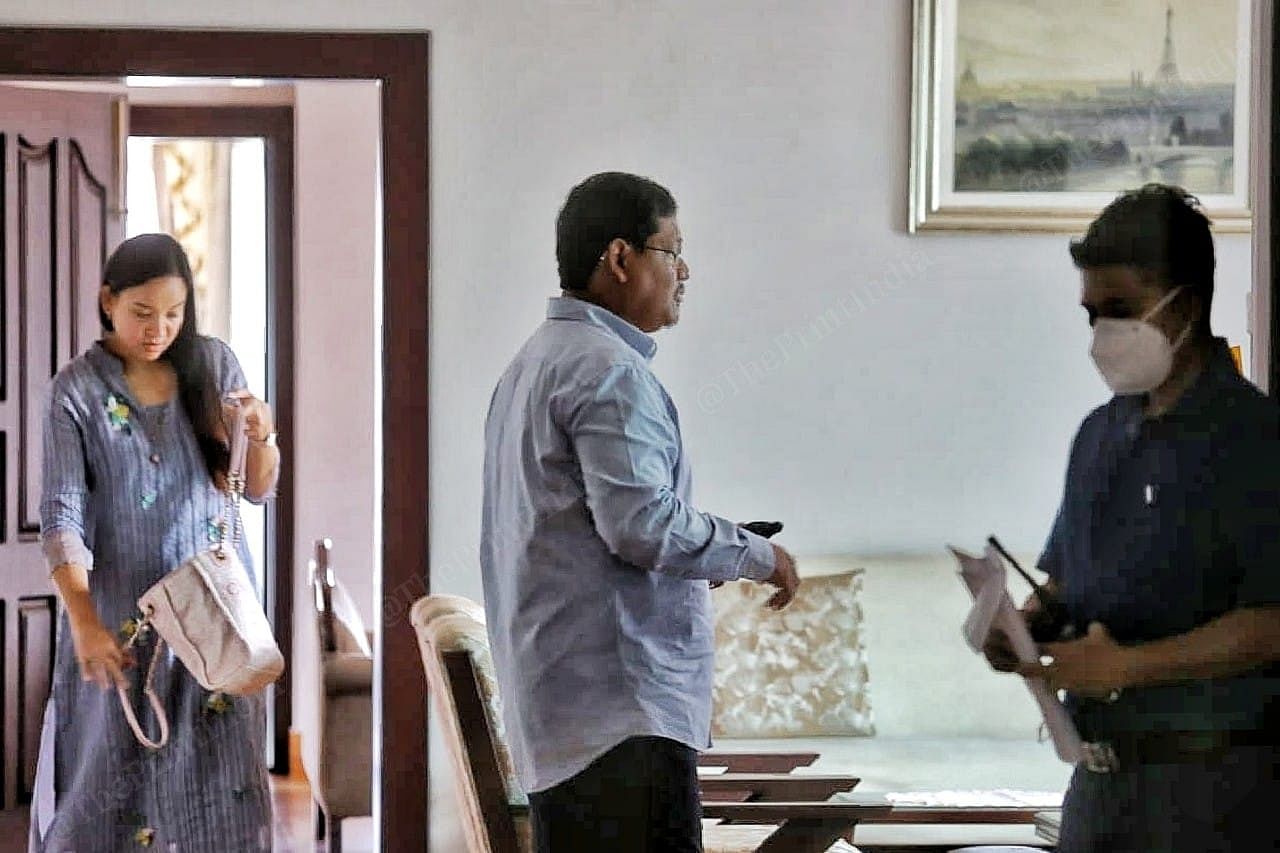 Chief minister of Meghalaya Conrad Sangma taking to his security Chief before leaving to his constituency Tura . with his wife Mehtab Agitok Sangma. | Photo: Praveen Jain | ThePrint