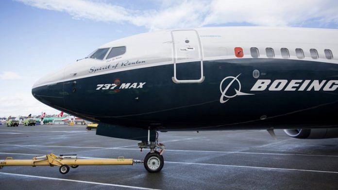 A Boeing Co. Max 737 jet sits parked in front of a hangar | Photo: Mike Kane | Bloomberg File Photo