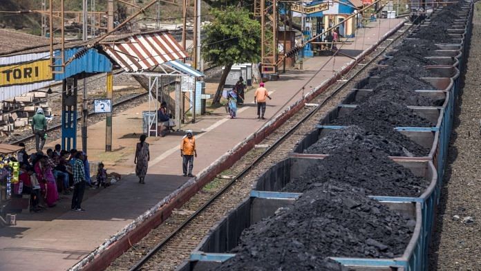 Freight wagons laden with coal sit at the Tori station operated by Indian Railways and funded by Coal India Ltd in Jharkhand, on 17 May, 2018. | Photographer: Prashanth Vishwanathan/Bloomberg