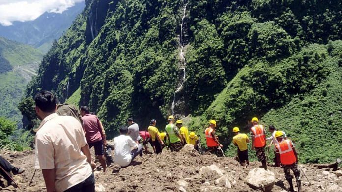SDRF personnel conduct a search for survivors during a rescue operation after a cloudburst hit the parts of Jumma village, at Dharchula, in Uttarakhand's Pithoragarh, on 30 August 2021 | ANI photo