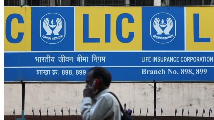 A man talks on a mobile phone outside the Life Insurance Corporation of India (LIC) branch in Mumbai. Photographer: Himanshu Bhatt/NurPhoto/Getty Images via Bloomberg