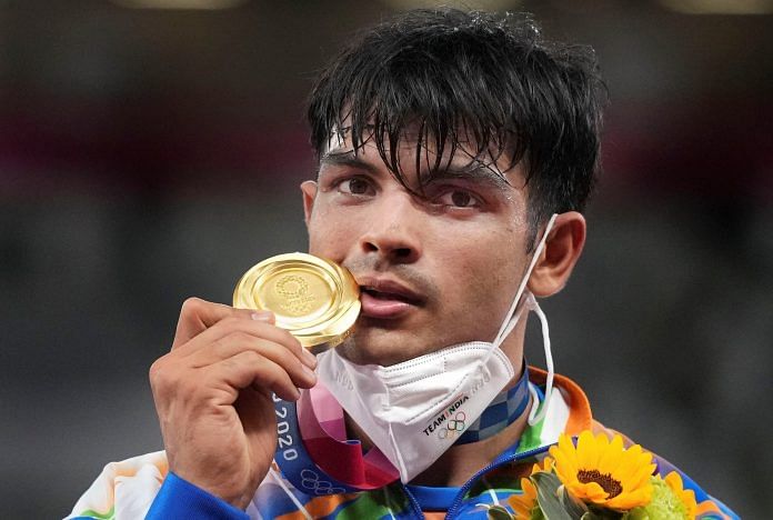 India's Neeraj Chopra with the gold medal after winning the men's javelin throw final at the 2020 Summer Olympics in Tokyo, on 7 August 2021 | PTI Photo