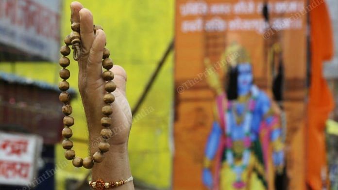 Representational image | A sadhu holds a Rudraksh, a string of beads considered auspicious among Hindus, in Ayodhya | Photo: Suraj Singh Bisht | ThePrint