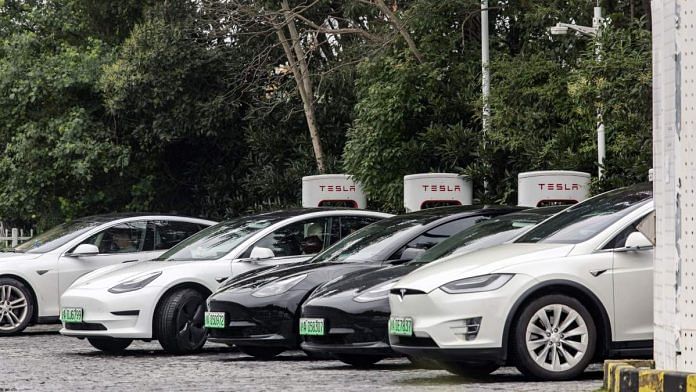 Tesla Inc. electric vehicles charge at a Tesla Supercharger station in a parking lot in Shanghai, China | Representational image | Photographer: Qilai Shen | Bloomberg
