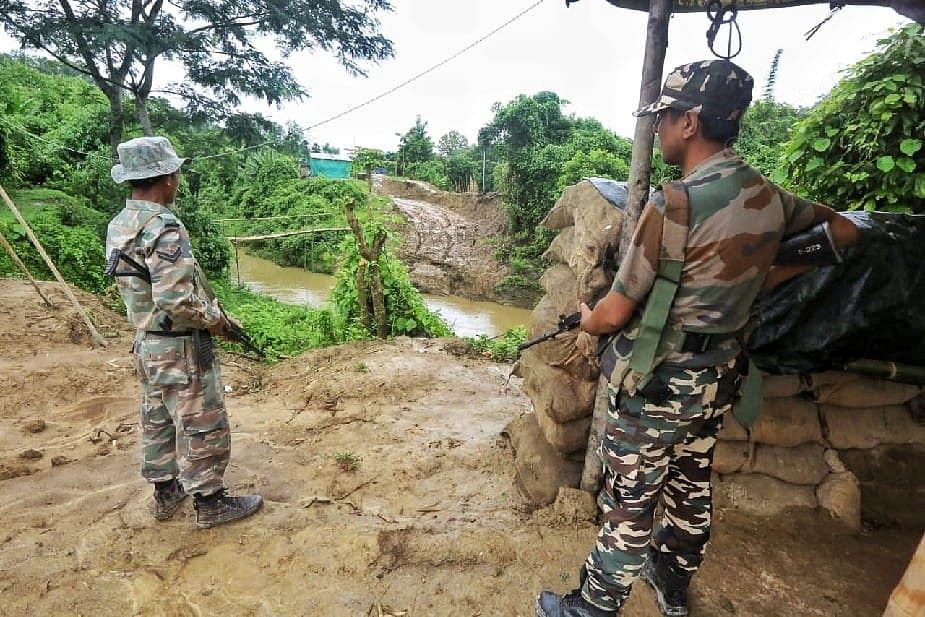 A Mizoram police personals keeps an eye on the Assam post | Photo: Praveen Jain | ThePrint