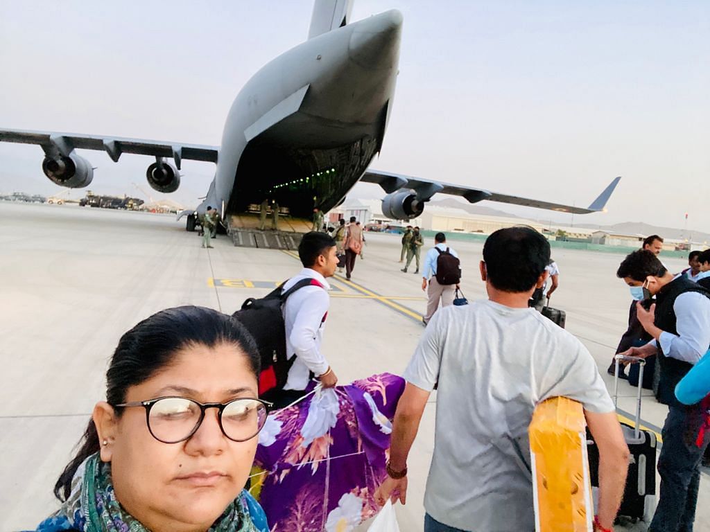 ThePrint's Nayanima Basu, accompanied by Indian embassy staff, waits to board the IAF's C-17 for the flight back to India | Nayanima Basu | ThePrint