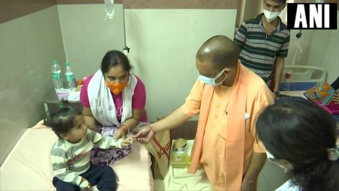Uttar Pradesh CM Yogi Adityanath visits children admitted at the Firozabad district hospital, on 30 August 2021 | Twitter/@ANINewsUP