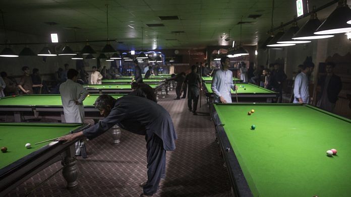 File photo of men playing snooker at a billiards club in Kabul, Afghanistan in 2017 | Photo: Victor J. Blue | Bloomberg