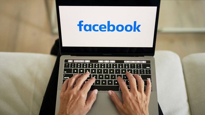Facebook logo displayed on a laptop | Representational image | Bloomberg