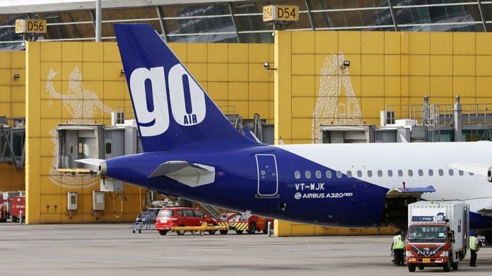 A Go Airlines Ltd. aircraft stands at Terminal 3 of Indira Gandhi International Airport in New Delhi | Photographer: T. Narayan | Bloomberg