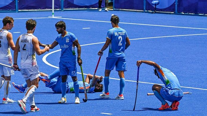 Indian players react after their men's field hockey semifinal match against Belgium, at the 2020 Summer Olympics, in Tokyo, on 3 August 2021 | PTI