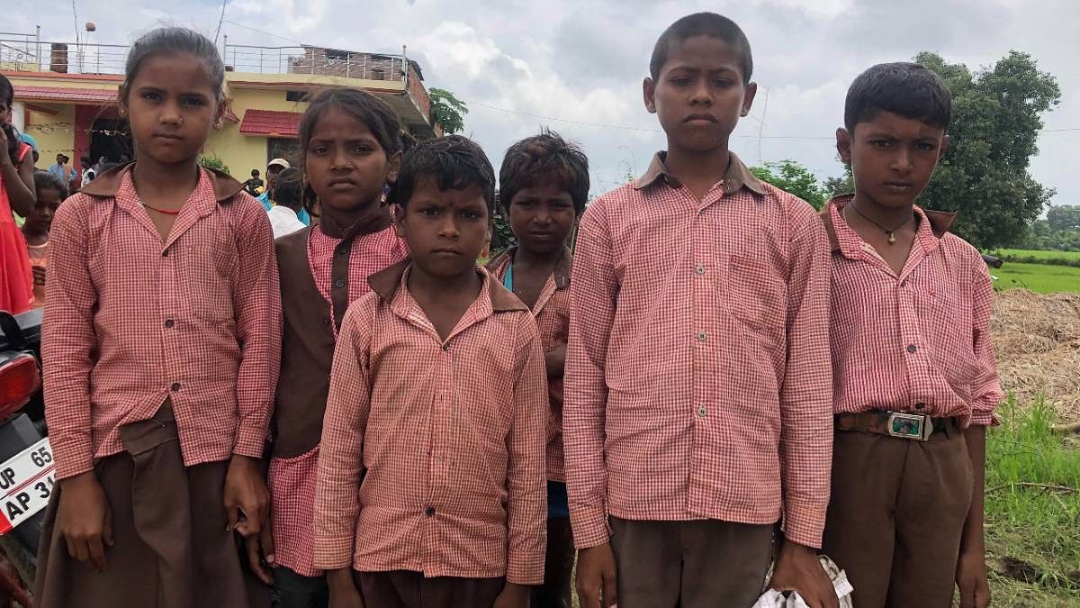 School uniforms lay discarded as the pandemic forced schools to remain closed for about a year-and-a-half. But in UP's Sonbhadra district, this group of children found an excuse to dress up in their uniforms as they gathered to collect the dry ration being distributed in lieu of mid-day meals.