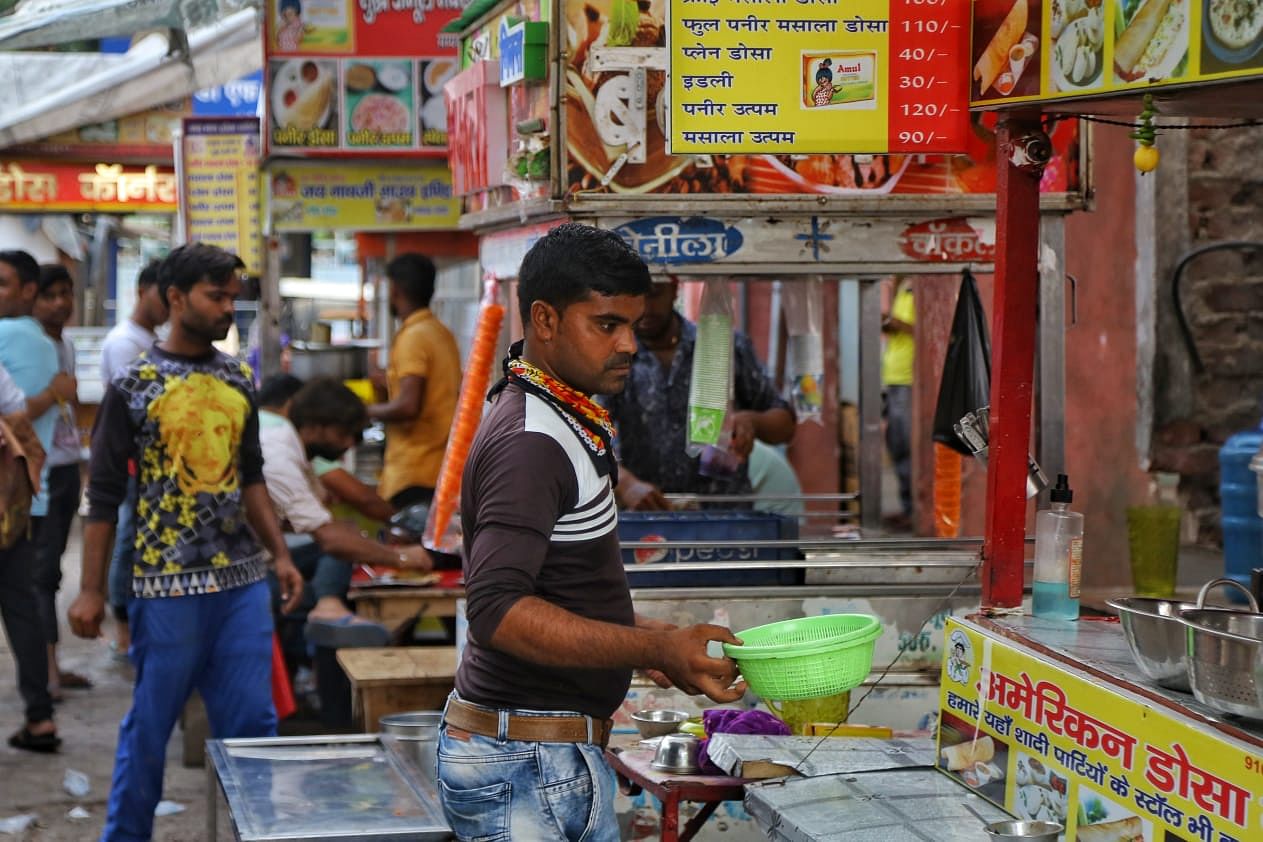 Aved at his family-run dosa stall in Mathura's Vikas Market. | Photo: Suraj Singh Bisht/ThePrint