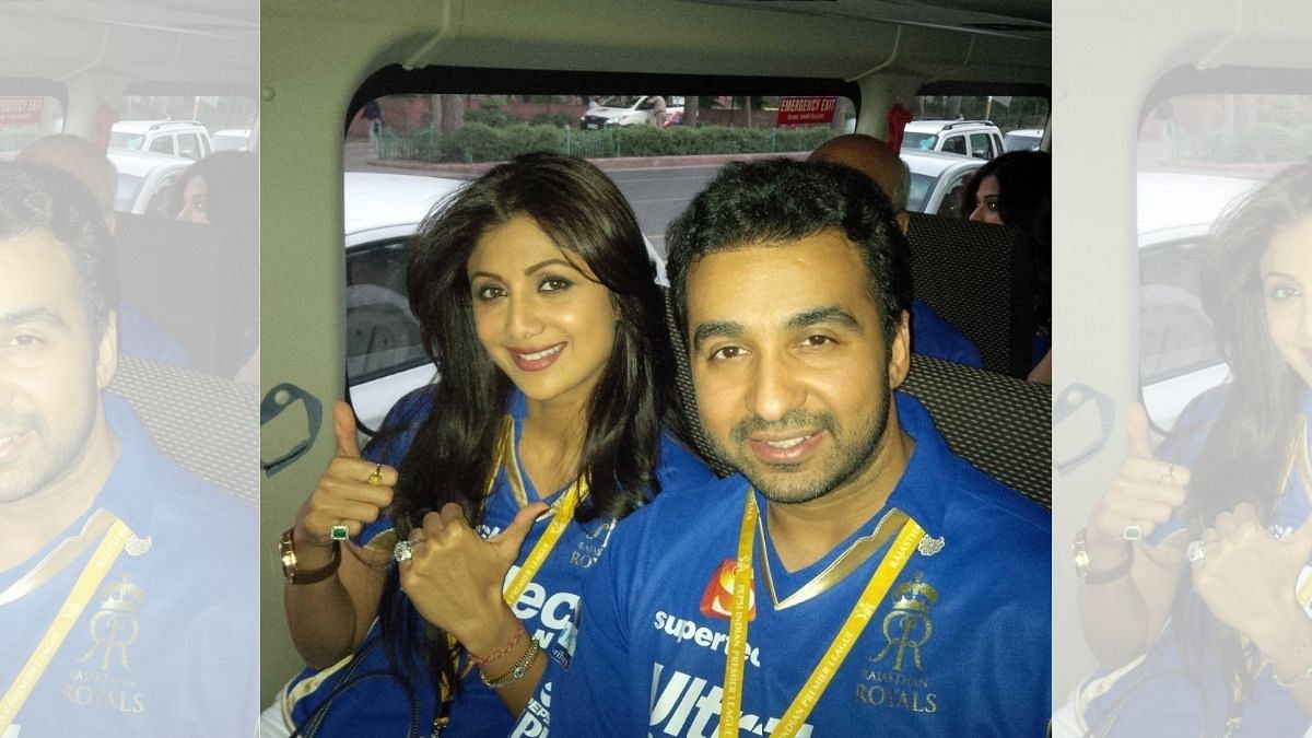 File photo of Raj Kundra and wife Shilpa Shetty posing in Rajasthan Royals jerseys as they head for a match | Twitter | @TheRajKundra