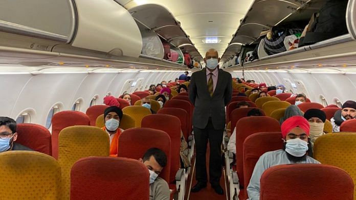 Evacuees from Afghanistan inside an Air India aircraft enroute to Delhi from Dushanbe, on 24 August 2021 | Twitter/@MEAIndia