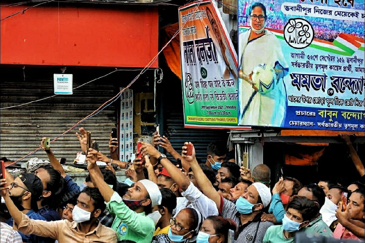 TMC supporters capture CM Mamata Banerjee as addresses from the stage in Ekbalpur | Photo: Praveen Jain | ThePrint 