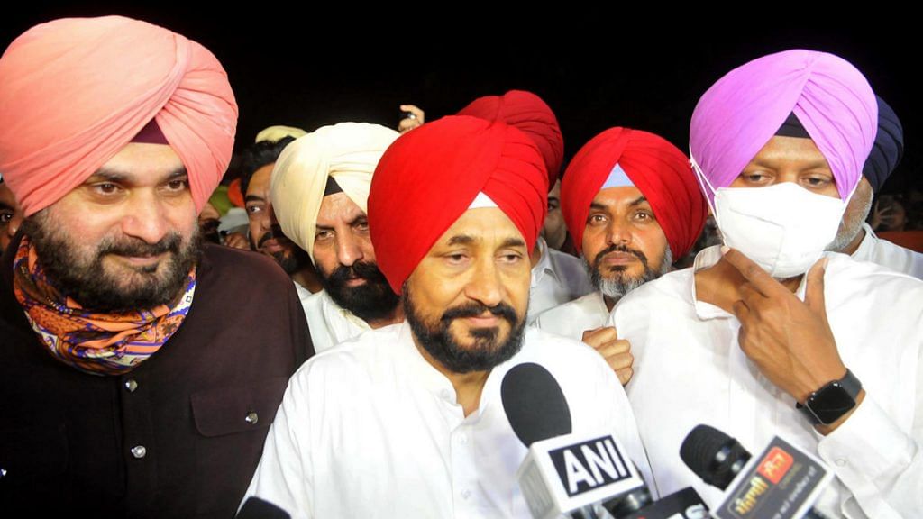 Punjab's new CM-designate Charanjit Singh Channi (centre) flanked by state Congress chief Navjot Sidhu (left) and other leaders after meeting Governor Banwarilal Purohit Sunday | Photo: ANI