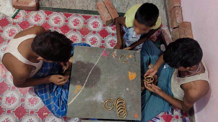 Three children making bangles at a small factory in Jaipur, Rajasthan | Photo: Manisha Mondal | ThePrint