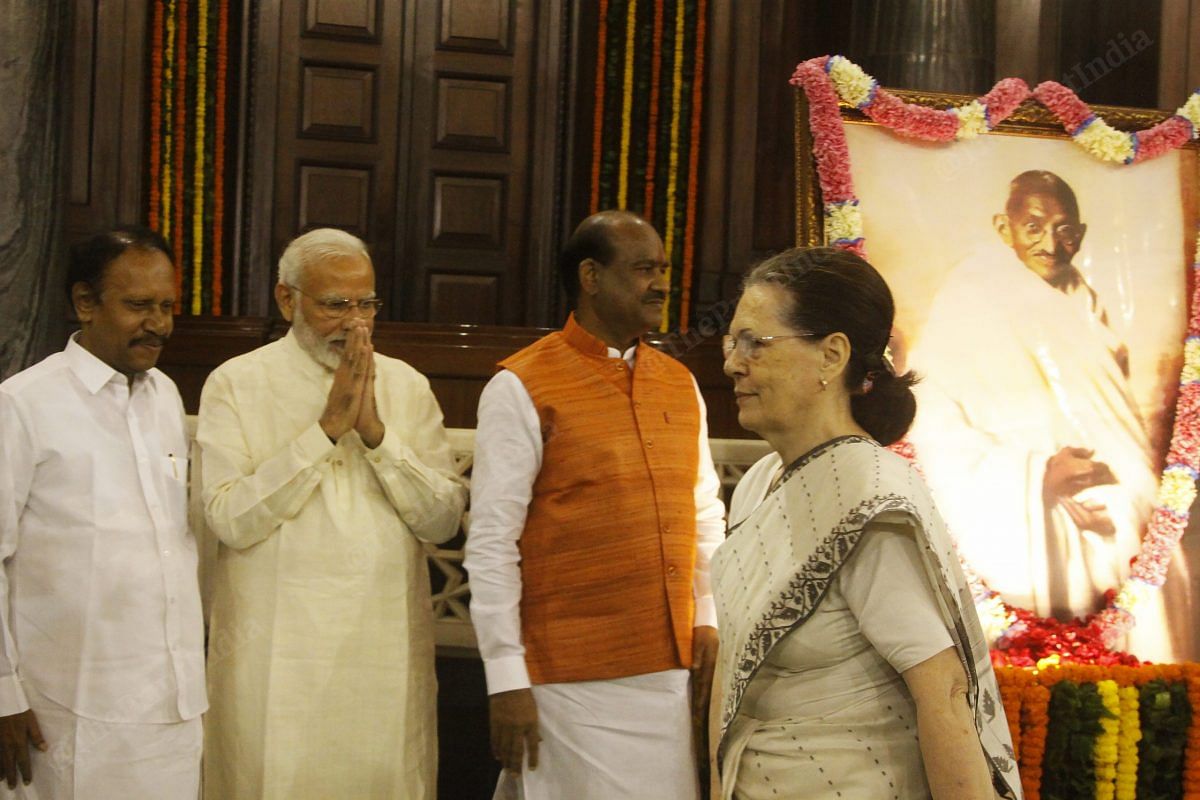 PM Modi, Congress President Sonia Gandhi and Lok Sabha speaker Om Birla at the Central Hall of Parliament on Mahatma Gandhi's 150th birth anniversary | Praveen Jain | ThePrint