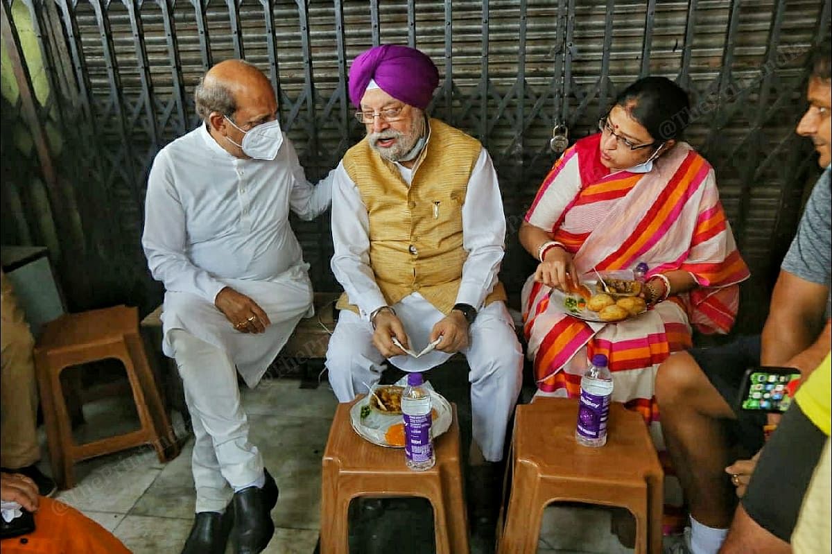 BJP leaders (from left to right) Dinesh Trivedi, Hardeep Singh Puri, Priyanka Tibrewal at one of the eateries in Kolkata | Photo: Praveen Jain | ThePrint