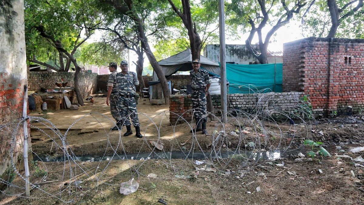 CRPF personnel stationed at the family’s home in Hathra | Photo: Manisha Mondal/ThePrint
