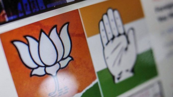 Logos for the Bharatiya Janata Party (BJP), left, and the Indian National Congress (INC) party are displayed on a computer at the Boom Live office in Mumbai | Bloomberg