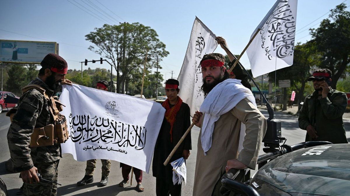 Taliban members hold the insurgent group's flags | Representational Image| Photographer: Wakil Kohsar/AFP/Getty Images via Bloomberg