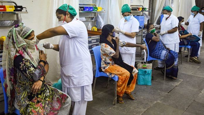 Women beneficiaries receive Covid-19 vaccine during a special vaccination drive for women in Mumbai on 27 September 2021 | PTI