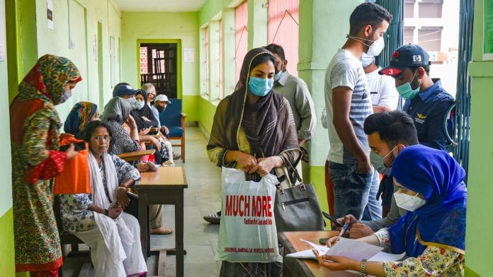 Teachers and students wait for a dose of Covid-19 vaccine during a special vaccination drive in Srinagar on 1 September 2021| PTI