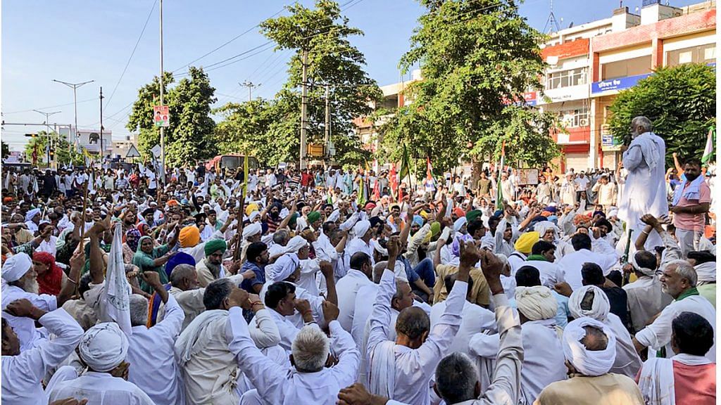Farmers during their sit-in protest outside the Mini Secretariat in Karnal on 8 August 2021| PTI