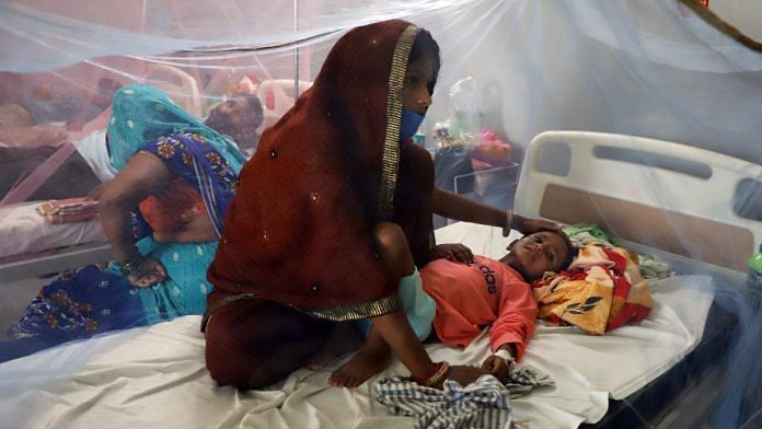 A mother takes care of her child as he receives a treatment during the ongoing fever outbreak, in UP on 8 September 2021| ANI