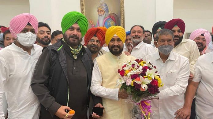 Punjab Congress chief Navjot Singh Sidhu with CM Charanjit Singh Channi after the latter's swearing-in Monday | Twitter | @sherryontopp