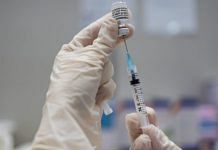 A nurse fills a syringe with a dose of the Pfizer Inc.-BioNTech SE Covid-19 vaccine | Bloomberg